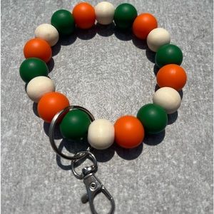 Silicone and wood beaded wristlet (forest green, orange and wood)